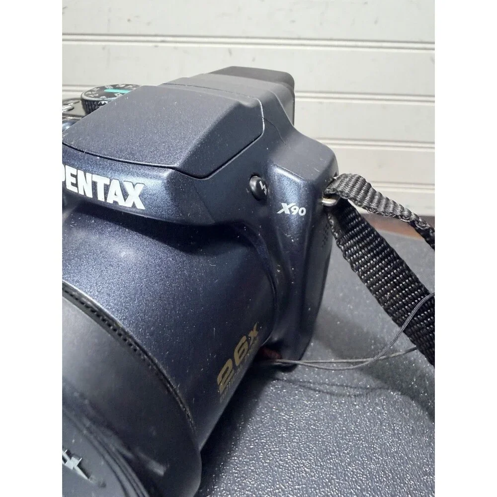 Pentax X90 12.1MP Digital Bridging Camera w/manual, Battery, Charger & Strap